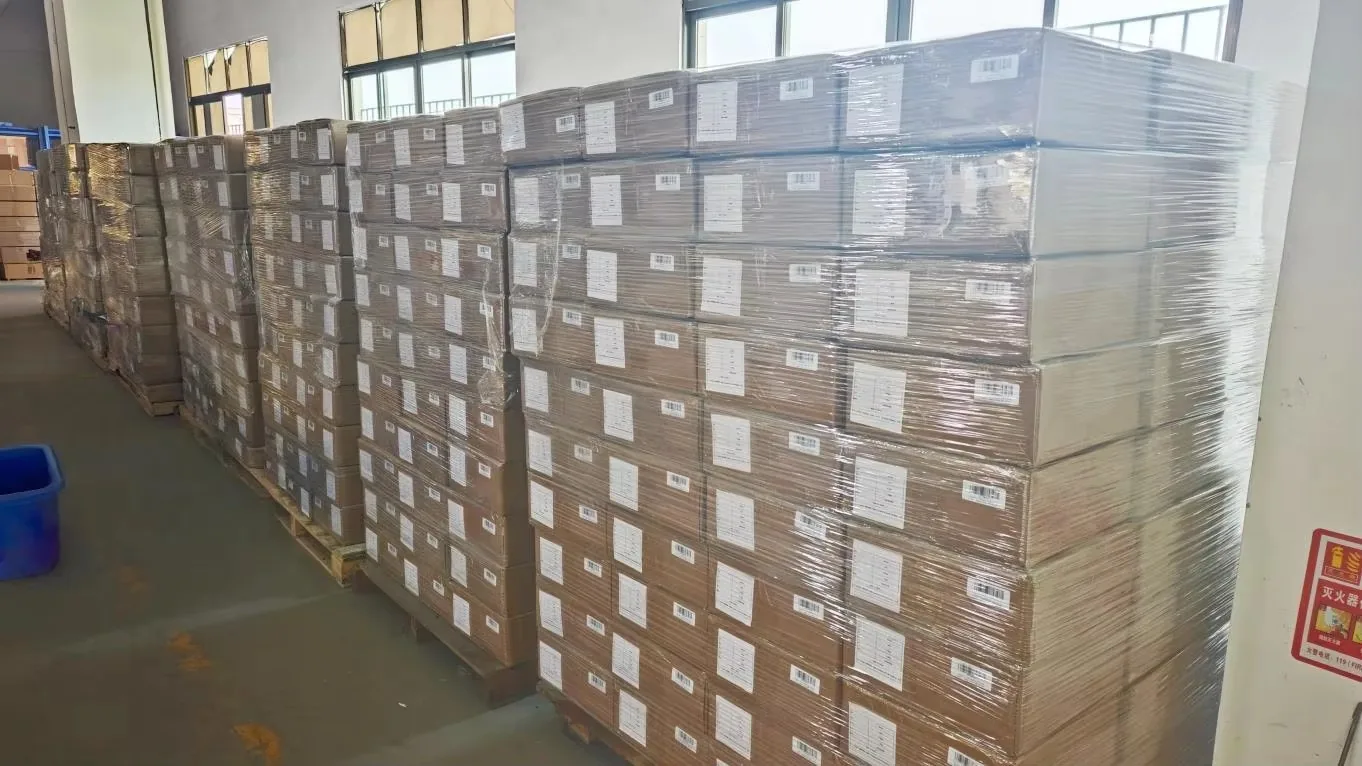 Wrapped and banded pallets of cartons stacked in a warehouse ready for dispatch